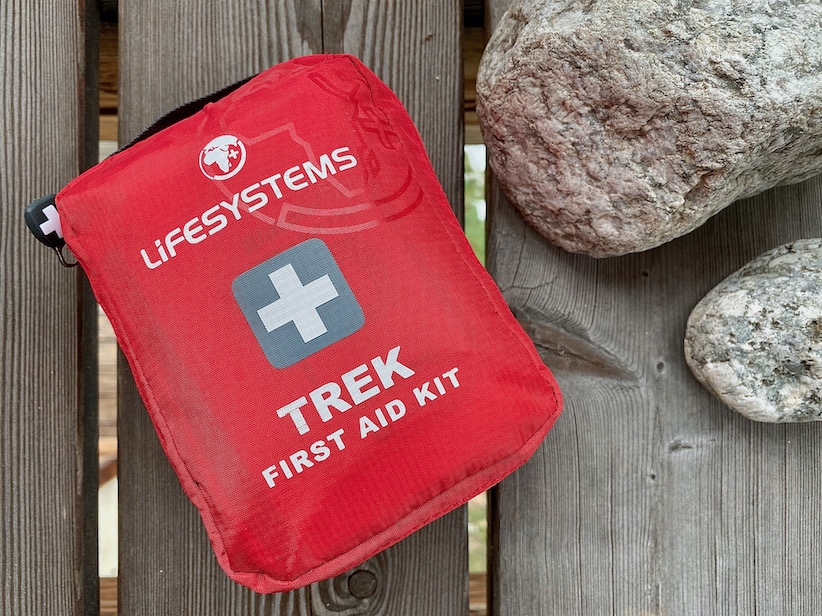 first aid kit on wooden deck