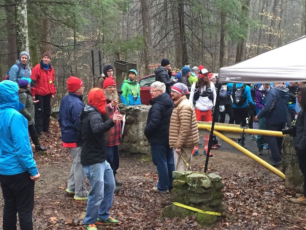 The Barkley Marathons runners waiting at the yellow gate for Laz to light his cigarette to start the race.
