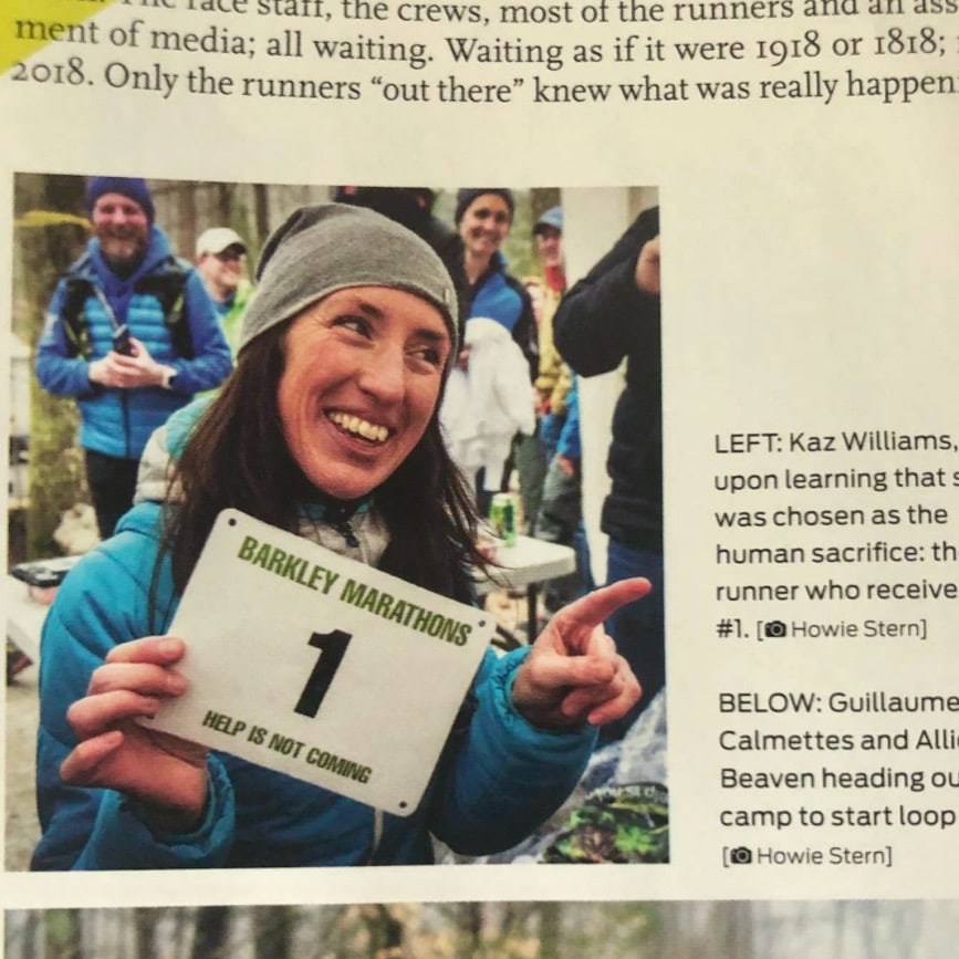 Magazine article on The Barkley Marathons with a photo of Kaz holding bib number 1.