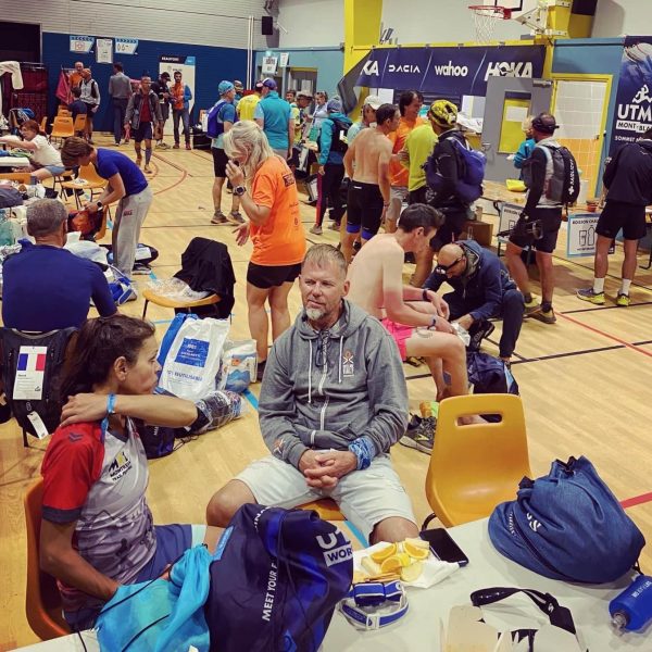 TDS runners in Beaufort aid station, eating, changing gear and resting.